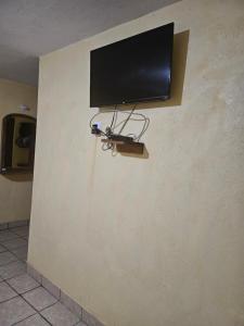 TV a/nebo společenská místnost v ubytování Hotel villas la aurora