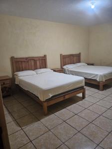 Postel nebo postele na pokoji v ubytování Hotel villas la aurora