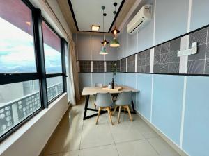 a dining room with a table and two chairs at Arte Plus Jalan Ampang KLCC in Kuala Lumpur