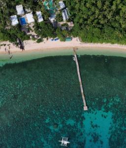 an aerial view of a beach and the water at Pili Beach Resort Agmanic in Santa Fe