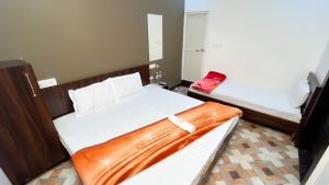 Voodi või voodid majutusasutuse Hotel Rudraksh toas +4 fotot