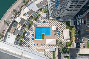 an overhead view of a swimming pool in a city at Perfect 2BD apartment in the heart of Marina - top spot in Dubai