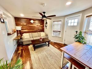 a living room with a couch and a ceiling fan at Ultra Modern - Entire 3 Bedroom Apartment - 5 min walk to the Beach in Wildwood
