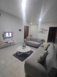 a living room with a couch and a table at Apartamento Llana in Santa Maria