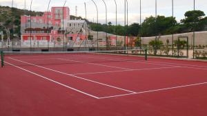 a tennis court with a net on top of it at Hotel Boutique Il Castellino Relais in Vieste