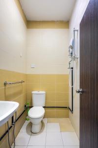 a bathroom with a toilet and a sink at Seaside Private Bungalow, Tg Bungah in Tanjung Bungah