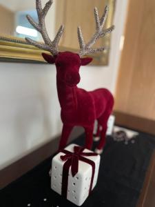 a figurine of a reindeer standing on a present at Branlea - In the Heart of Ludlow in Ludlow