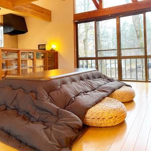 a large bed sitting on the floor in a room at King's house in Hakuba