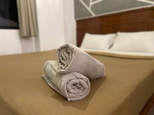 Postel nebo postele na pokoji v ubytování Pangkor BeachWalk Studio