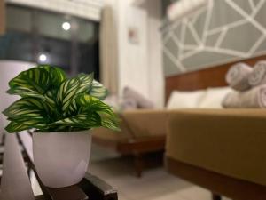 Postel nebo postele na pokoji v ubytování Pangkor BeachWalk Studio