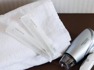 Katil atau katil-katil dalam bilik di Toyama Town Hotel