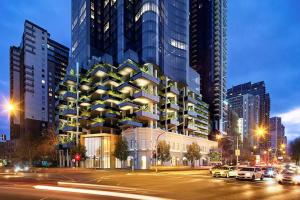 a large building on a city street at night at Sky Home - Ocean view 2 BR with Sunrise and Sunset views in Melbourne