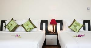 Voodi või voodid majutusasutuse Serenity Villa Hotel toas