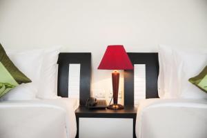 Voodi või voodid majutusasutuse Serenity Villa Hotel toas