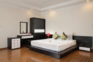 Voodi või voodid majutusasutuse Serenity Villa Hotel toas