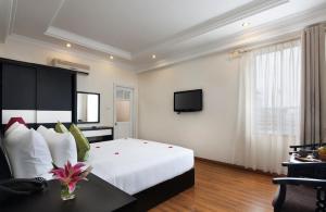 Voodi või voodid majutusasutuse Serenity Villa Hotel toas