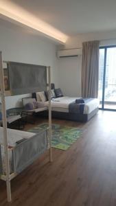 Postel nebo postele na pokoji v ubytování The Penthouse and Suite SGR Melaka