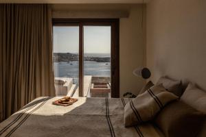Posedenie v ubytovaní The Skyvilla Mykonos - A Landmark Property with Breathtaking Views of the Psarou bay