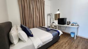 Postel nebo postele na pokoji v ubytování The Penthouse and Suite SGR Melaka