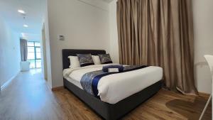 Postel nebo postele na pokoji v ubytování The Penthouse and Suite SGR Melaka