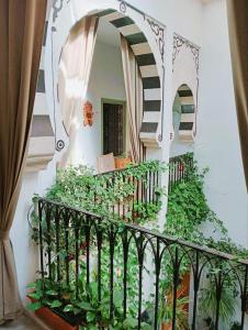 a stairway with a railing and a mirror at El Patio Courtyard House in Tunis
