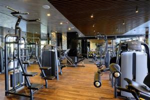 a gym with several treadmills and machines at Private 1bedroom apartment in SPA Resort in Bansko