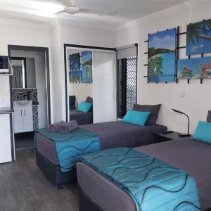 מיטה או מיטות בחדר ב-The Dugongs' Rest