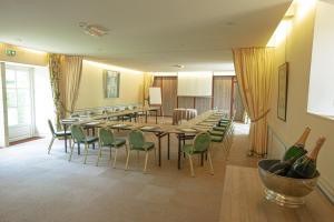 a dining room with a long table and chairs at Château De Noirieux in Briollay +116 photos