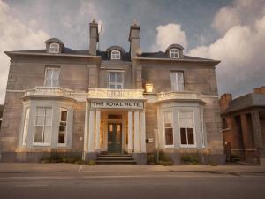 a building with the royal hotel in front of it at The Royal Hotel Elgin in Elgin