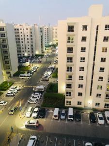 an aerial view of a parking lot in a city at Private bedroom with Burj View in Dubai