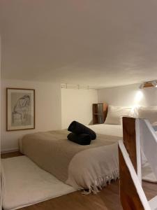 a bedroom with two beds with a pillow on it at Cocoon Gallery Paris in Paris