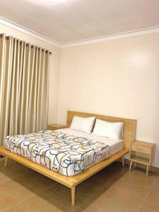 a bed sitting in a room with at House in Kampala in Kampala