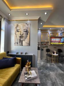 a living room with a couch and a table at TAKSİM LARİSSA RESİDENCE in Istanbul