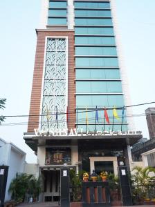 a building with a sign on top of it at The Vaishnavi in Deoghar