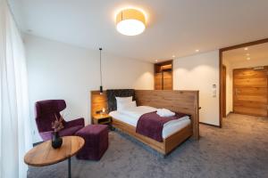 Postel nebo postele na pokoji v ubytování Kur- und Wellnesshotel Förch