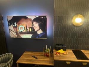 TV a/nebo společenská místnost v ubytování Silence Hanza Tower Szczecin