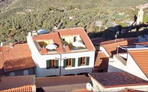 an aerial view of a white house with red roofs at Borgata Castello in Chiusanico