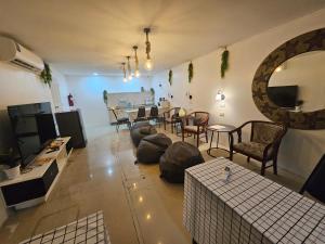 an overhead view of a living room with a couch and chairs at Jomtien Beach Hostel in Jomtien Beach