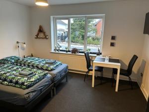 Postel nebo postele na pokoji v ubytování Ikast Bed & Kitchen