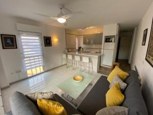 a living room with a couch and a table at Apartment Minerva in Benalmádena