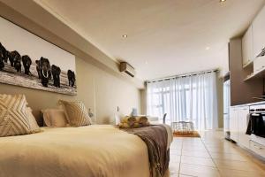 Ένα ή περισσότερα κρεβάτια σε δωμάτιο στο Picturesque Luxury Studio in The Icon Aparthotel +21 φωτογραφίες