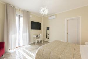 TV a/nebo společenská místnost v ubytování B&B Torre dei Monaci