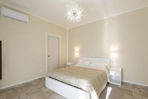 Postel nebo postele na pokoji v ubytování B&B Torre dei Monaci