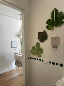 a hallway with green plants on the wall at GuestRoom Ia cascina di Bea in Torre Boldone
