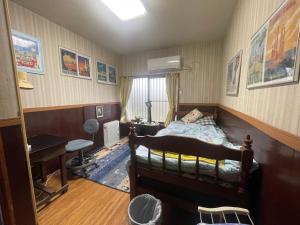 Postel nebo postele na pokoji v ubytování Jiji-Baba house
