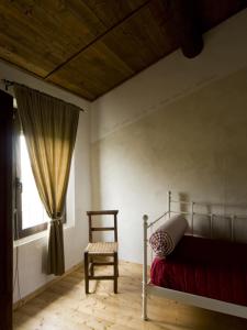 Säng eller sängar i ett rum på Agriturismo Viridarium