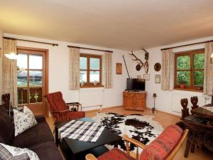 a living room with a couch and a table at Flat in Mittersill near Ski Slopes in Mittersill