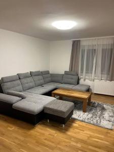 a living room with a couch and a coffee table at Wohnung in Hüttau in Sonnberg