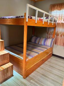 a couple of bunk beds in a room at The Quiet Villa in Tagaytay