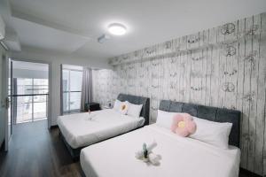Katil atau katil-katil dalam bilik di NEW Maritime Luxury Pool View Duplex Suite 601 +20 gambar